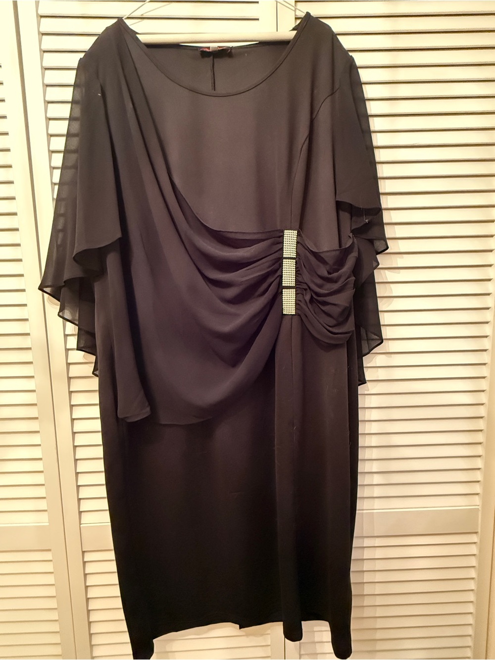 Elegant Black Draped Evening Dress with Rhinestone Accent and Sheer Capelet